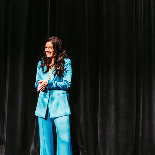 passion struck speakers | Top Female Keynote Speakers: Empowering Women Leaders to Inspire Your Next Event Image of top female keynote speaker Erin Diehl on stage